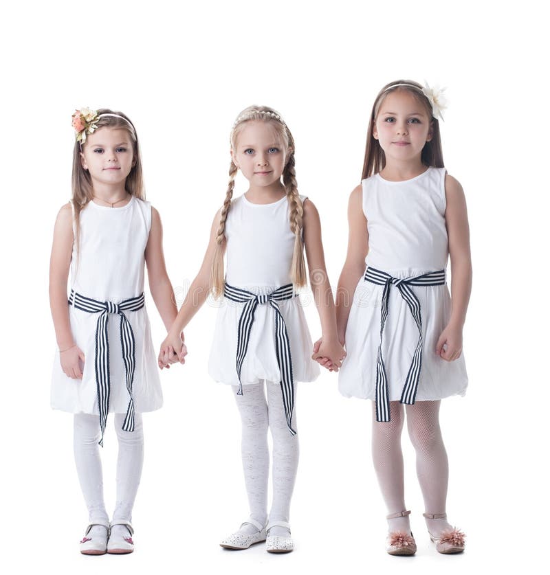 Le bambine nel colore rosa di fascino si veste e si avvolge immagine stock Le bambine nel colore rosa di fascino si veste e si avvolge immagine stock