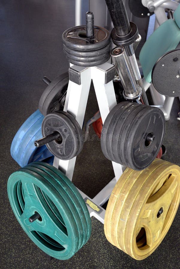 Barbell with different sizes and weights for weight lift training in modern gym. Barbell with different sizes and weights for weight lift training in modern gym.