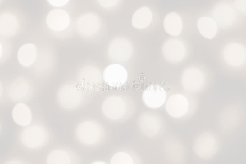 Le bokeh de lumières blanches a brouillé le fond, belle texture argentée trouble de fête de vacances de Noël de résumé, l'espace image libre de droits