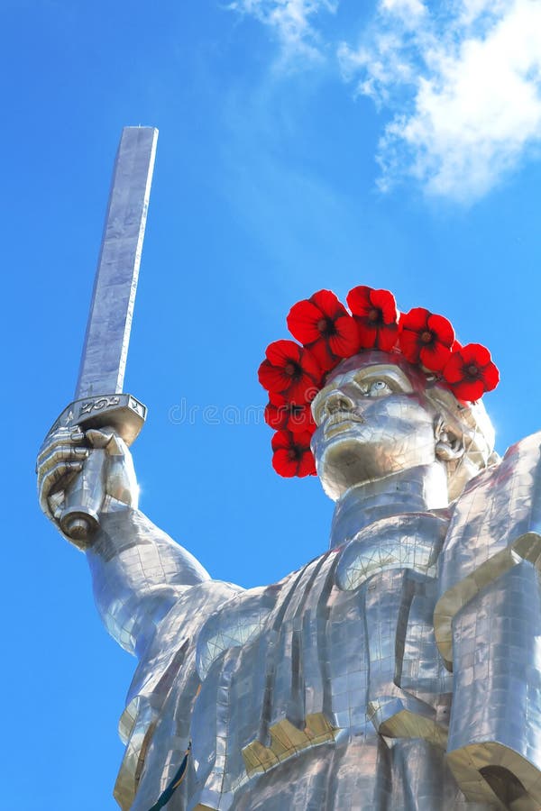 The monument `Mother Motherland` decorated with a wreath of poppies on the Day of Remembrance and Reconciliation in Kyiv, Ukraine. The monument `Mother Motherland` decorated with a wreath of poppies on the Day of Remembrance and Reconciliation in Kyiv, Ukraine