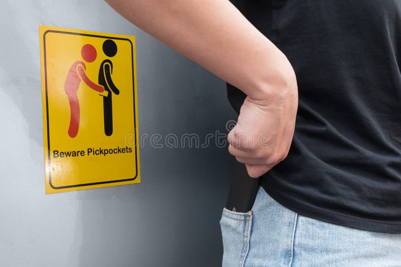Le donne sono borsaiolo attento perché vede si guarda dai borsaioli firma il simbolo fotografia stock Le donne sono borsaiolo attento perché vede si guarda dai borsaioli firma il simbolo fotografia stock