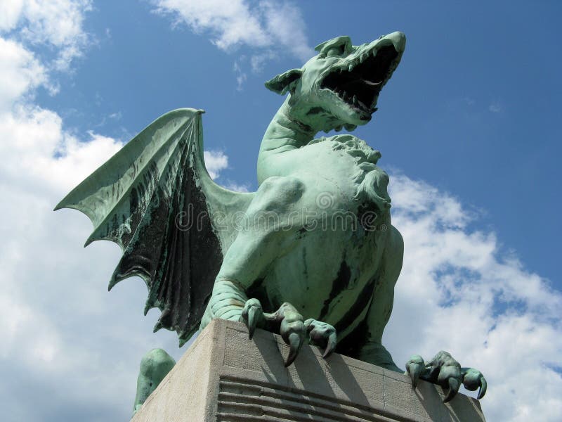 One of the four sheet-copper dragon statues which stand on pedestals at four corners of Ljubljana Zmajski most that have become a symbol of the city. The bridge opened in 1901, and has the third largest arch in Europe. One of the four sheet-copper dragon statues which stand on pedestals at four corners of Ljubljana Zmajski most that have become a symbol of the city. The bridge opened in 1901, and has the third largest arch in Europe.