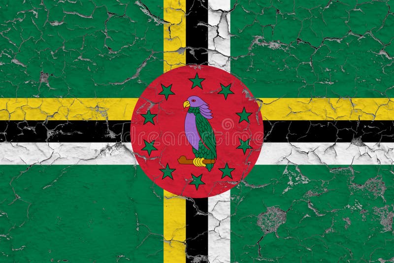 Le drapeau de la Dominique a peint sur le mur sale criqué Mod?le national sur la surface de style de cru photographie stock libre de droits Le drapeau de la Dominique a peint sur le mur sale criqué Mod?le national sur la surface de style de cru photographie stock libre de droits