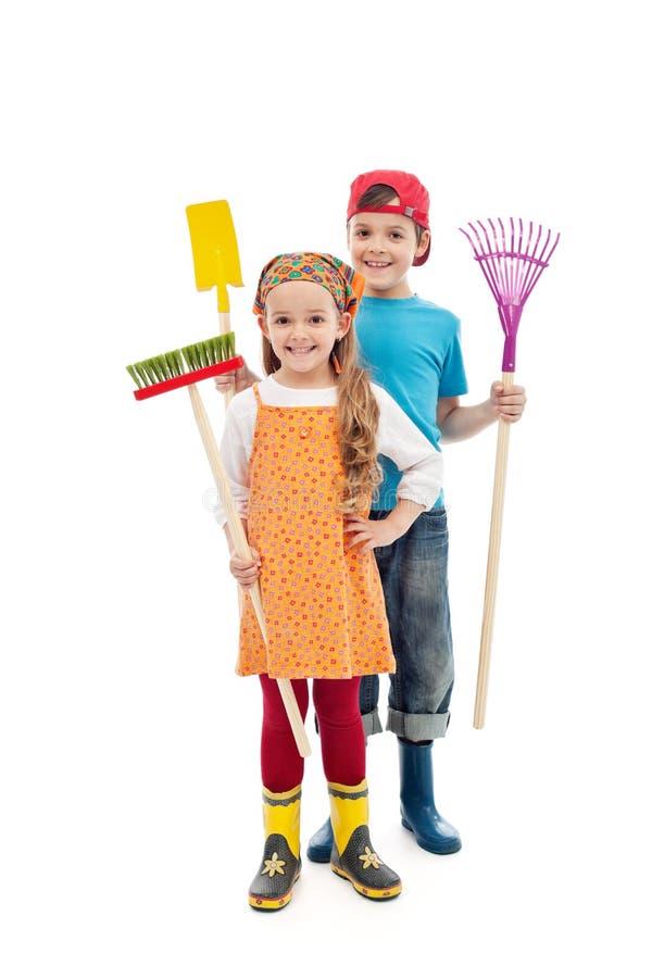 Happy spring kids - with gardening tools and rubber boots, isolated. Happy spring kids - with gardening tools and rubber boots, isolated