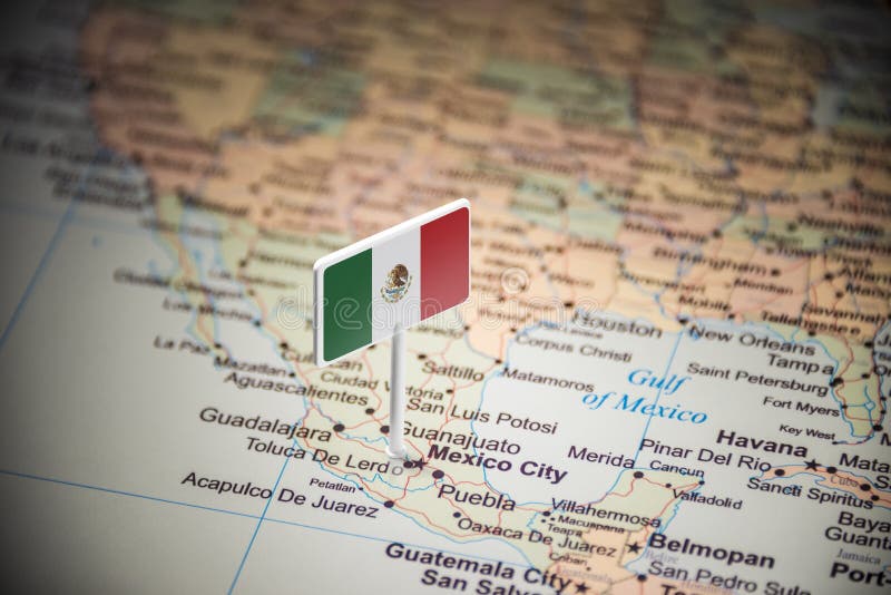 Le Mexique a identifié par un drapeau sur la carte photos stock Le Mexique a identifié par un drapeau sur la carte photos stock