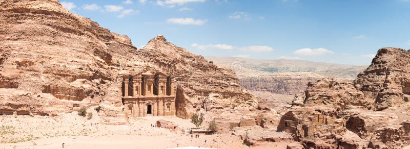 The Monastery (Ad Deir), an example of Nabatean classical style, Petra, Jordan. Panormaic view with surronding cliffs. The Monastery (Ad Deir), an example of Nabatean classical style, Petra, Jordan. Panormaic view with surronding cliffs