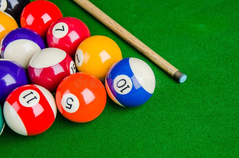 Billiard balls on green table with billiard cue, Snooker, Pool game. Billiard balls on green table with billiard cue, Snooker, Pool game.