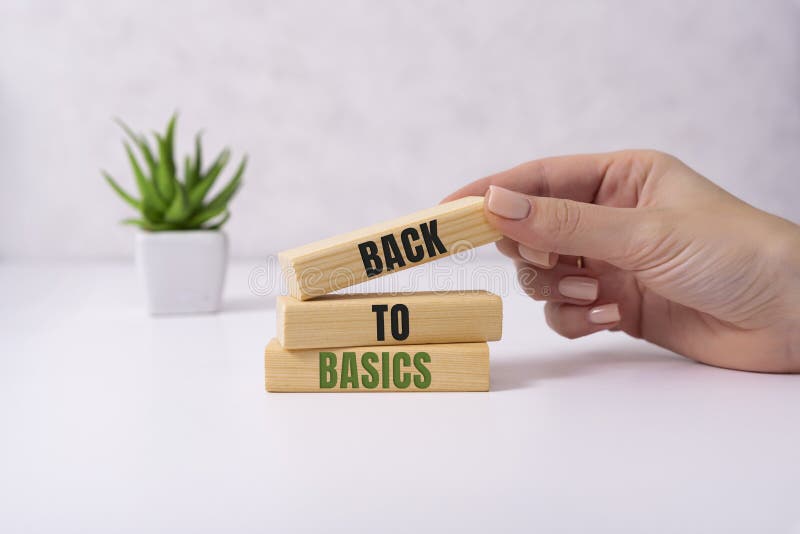 The words back to basics made of letters on wooden blocks. back to basics - fundamental principles concept. The words back to basics made of letters on wooden blocks. back to basics - fundamental principles concept