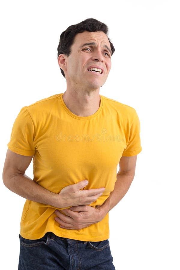 Le patient a un mal d'estomac constipated Il ` s sur ses pieds isola image stock Le patient a un mal d'estomac constipated Il ` s sur ses pieds isola image stock