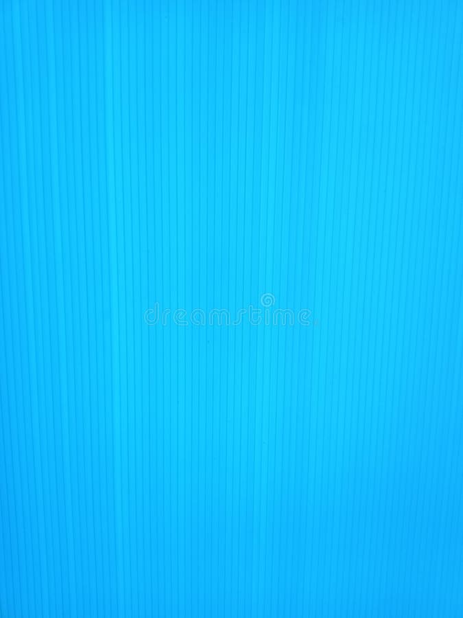 Blue corrugated plastic surface with beautiful lines pattern. Blue corrugated plastic surface with beautiful lines pattern.