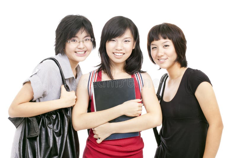 Le ragazze cinesi asiatiche dell'adolescente si raccolgono dopo il banco fotografie stock libere da diritti Le ragazze cinesi asiatiche dell'adolescente si raccolgono dopo il banco fotografie stock libere da diritti