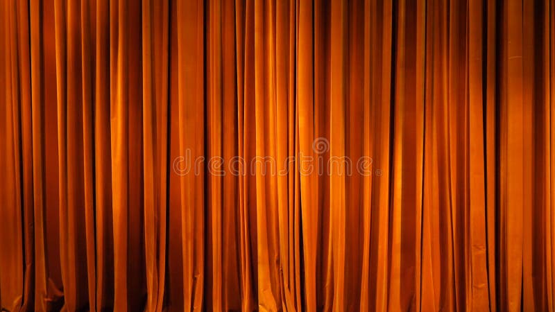 The yellow curtain. Theatrical scenes with light from the spotlights in the closed position. The yellow curtain. Theatrical scenes with light from the spotlights in the closed position.