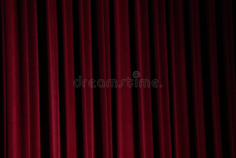 Red Curtain close before theatre drama begin and lighting shade of color and dark drapes fold background. Red Curtain close before theatre drama begin and lighting shade of color and dark drapes fold background