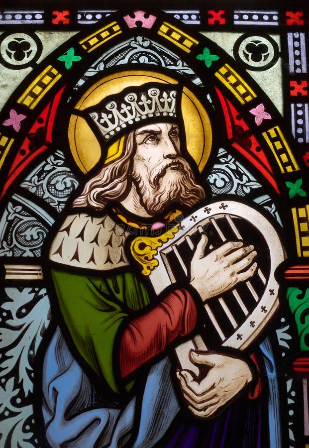 Detail of victorian stained glass church window in Fringford depicting King David, the author fo the psalms in the Old testament with a hand harp. Detail of victorian stained glass church window in Fringford depicting King David, the author fo the psalms in the Old testament with a hand harp