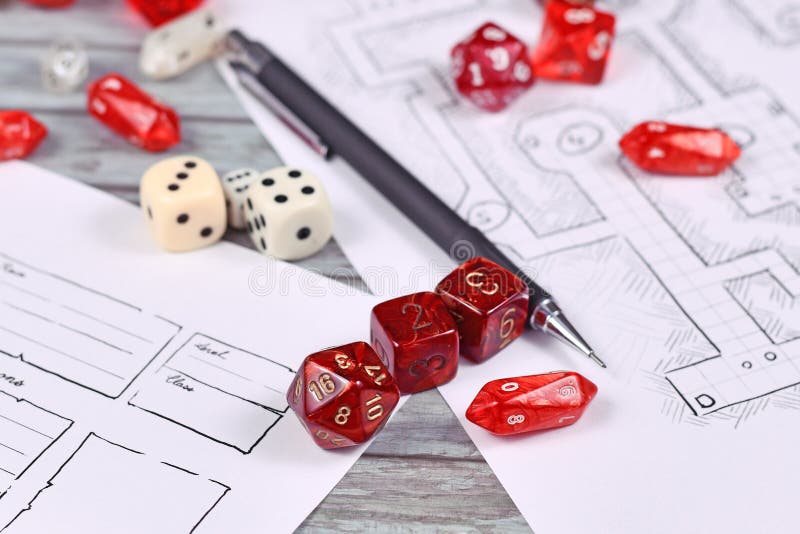 Red tabletop role playing RPG game dices on blurry hand drawn dungeon map and character sheet with pen. Red tabletop role playing RPG game dices on blurry hand drawn dungeon map and character sheet with pen