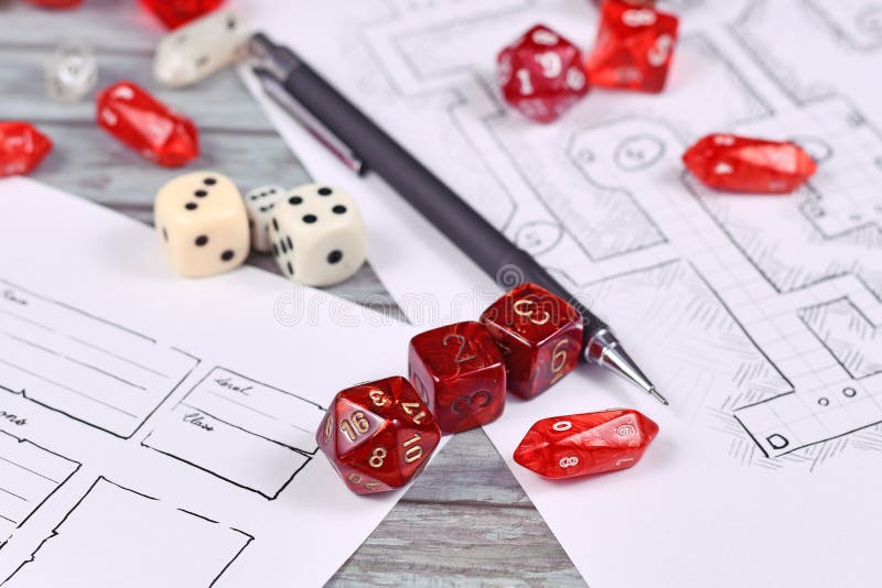 Various red tabletop role playing RPG game dices on blurry hand drawn dungeon map and character sheet. Various red tabletop role playing RPG game dices on blurry hand drawn dungeon map and character sheet