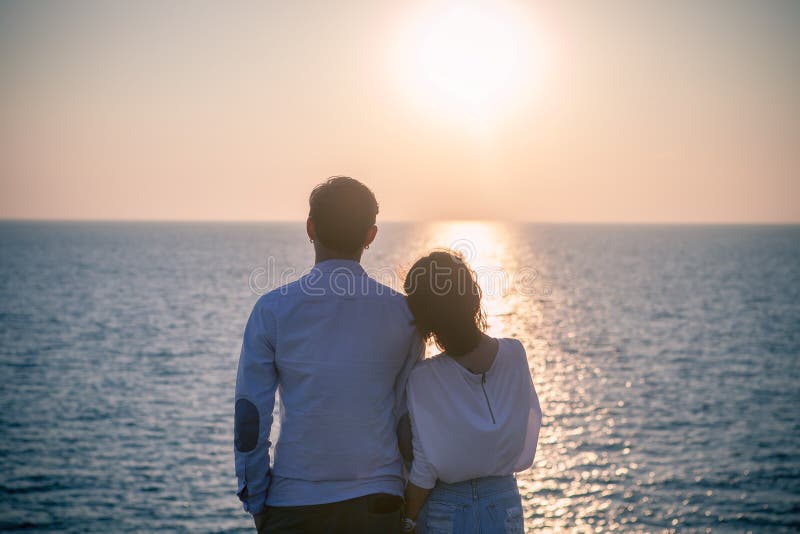 Hipster photography style of younger love couples vacation relaxing with sun set sky at destination sea side happiness emotion. Hipster photography style of younger love couples vacation relaxing with sun set sky at destination sea side happiness emotion