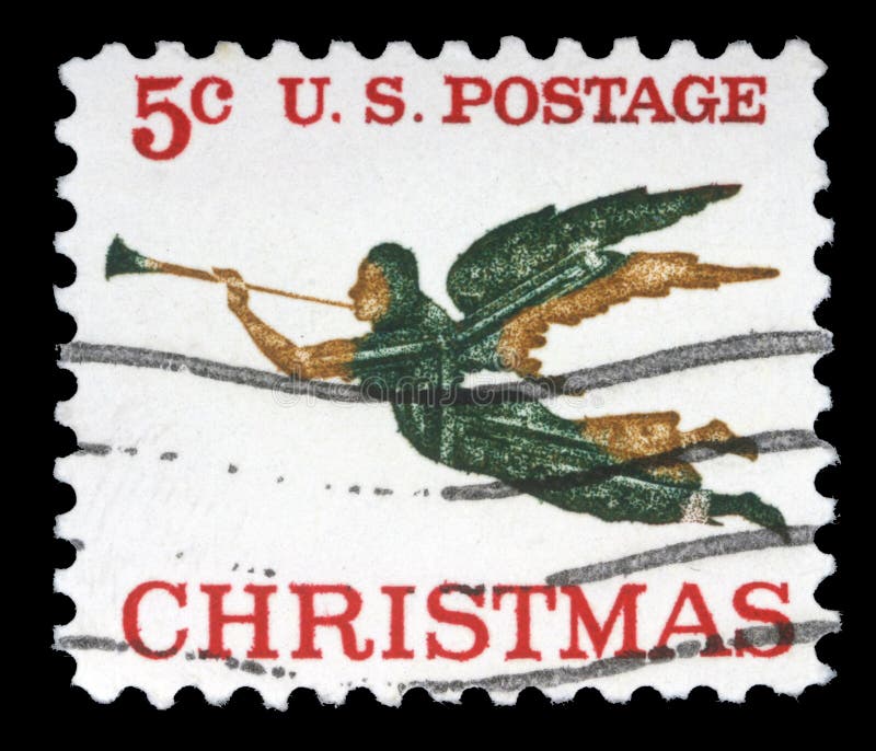 Le timbre de Noël imprimé aux Etats-Unis montre l'ange avec le klaxon photographie stock Le timbre de Noël imprimé aux Etats-Unis montre l'ange avec le klaxon photographie stock