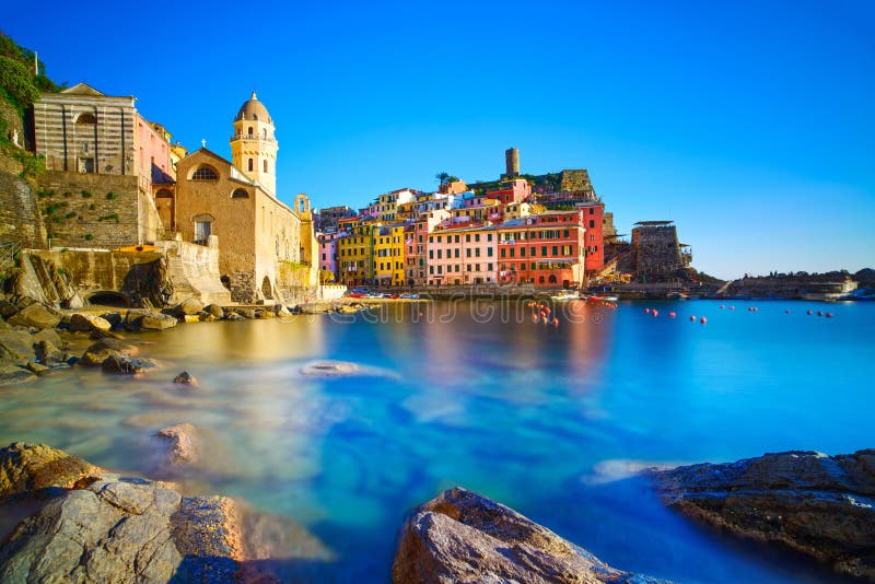 Vernazza village, curch, rocks and sea harbor on sunset, Seascape in Five lands, Cinque Terre National Park, Liguria Italy Europe. Long Exposure. Vernazza village, curch, rocks and sea harbor on sunset, Seascape in Five lands, Cinque Terre National Park, Liguria Italy Europe. Long Exposure.