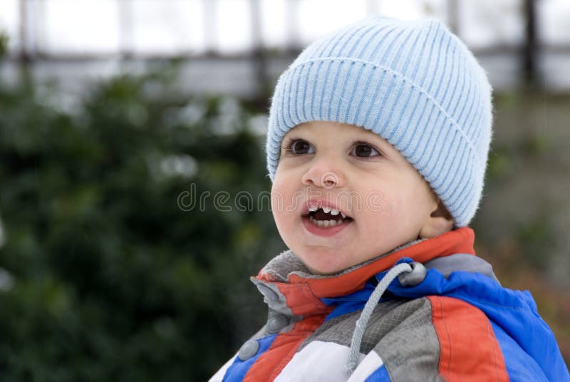 A little baby boy smiling in a winter day. A little baby boy smiling in a winter day