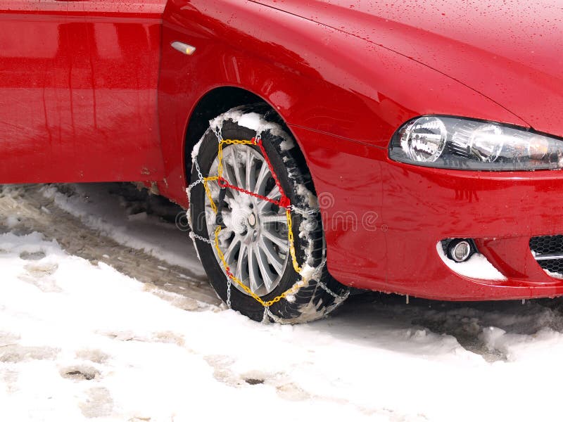 Sport Car with snow chains. Photo taken in the village of Canfranc, Huesca (SPAIN)near the ski stations of Candanchú and Astún. Sport Car with snow chains. Photo taken in the village of Canfranc, Huesca (SPAIN)near the ski stations of Candanchú and Astún.