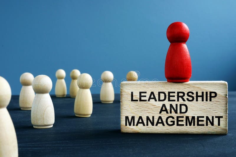 Leadership and management written on a block