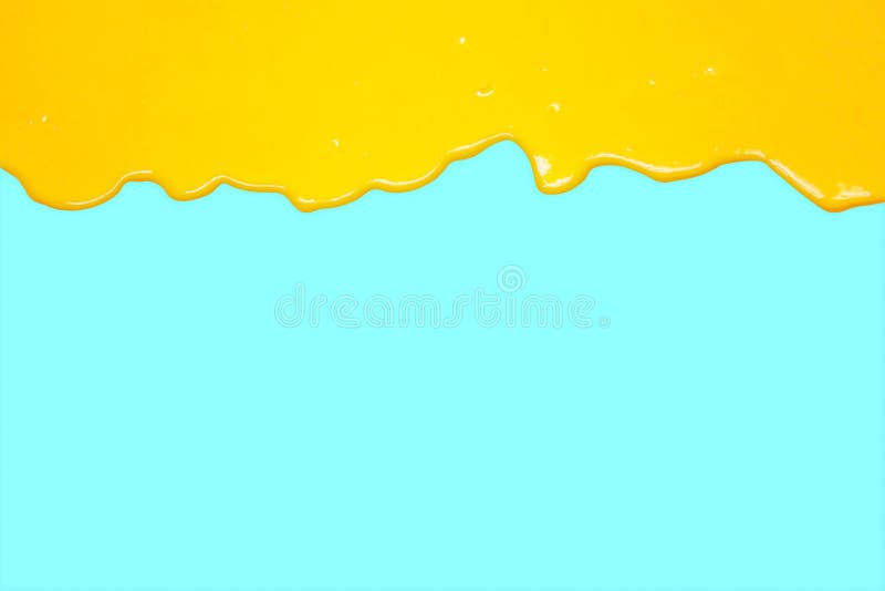 Leaking Yellow Liquid on a Blue Background, Orange Juice Stock Photo