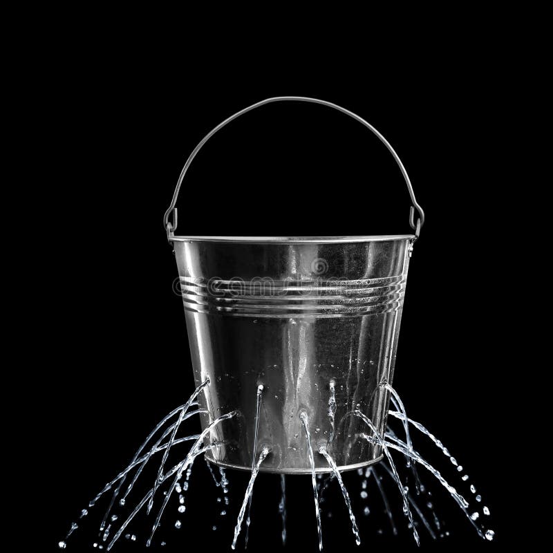 Leaky bucket with water on black background