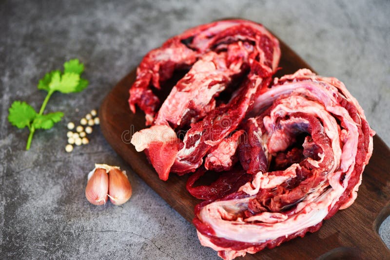 Lean meat beef butcher grilled barbecue / Fresh raw meat beef for grill with spices garlic on wooden cutting board and black royalty free stock images Lean meat beef butcher grilled barbecue / Fresh raw meat beef for grill with spices garlic on wooden cutting board and black royalty free stock images