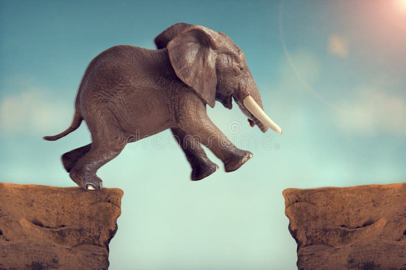 Leap of faith concept elephant jumping across a crevasse stock image Leap of faith concept elephant jumping across a crevasse stock image