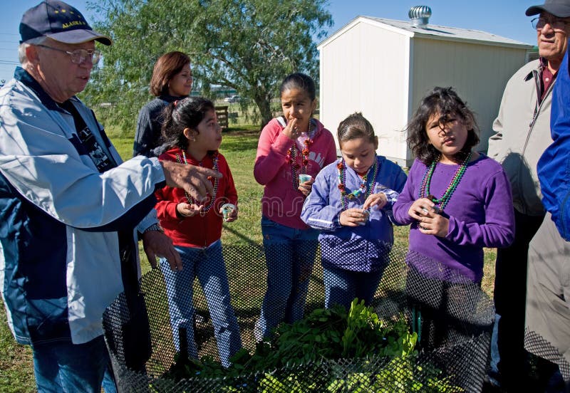 At the Cameron County Master Gardener Arboretum, a group of Children learn about composting from an expert while having a composting snack (a snack made from ingredients look like composting ingredients). This is the event for the American Recycle Day on Nov 15. Nov 15 is also the Texas recycles day. Regenerate stock images, royalty-free photos and pictures