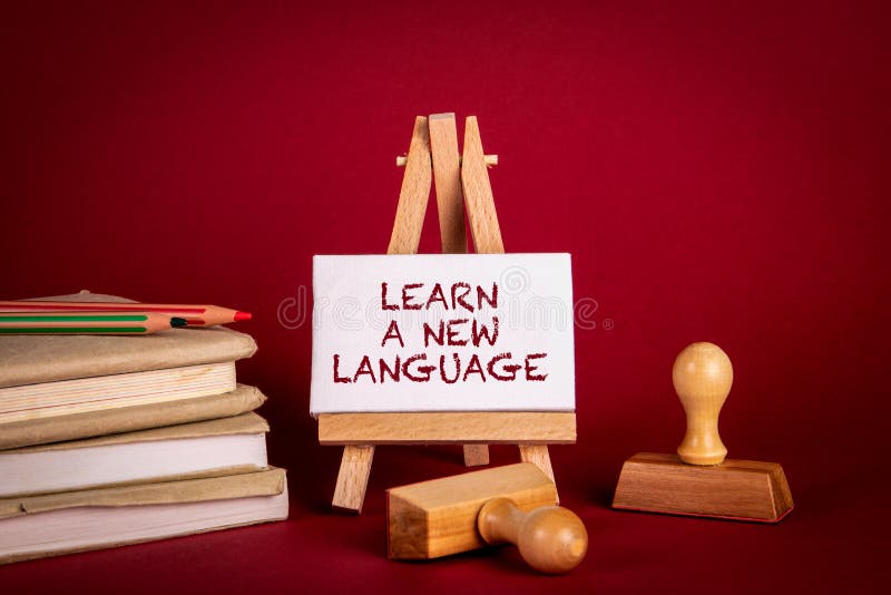 Learn a New Language. Stack of books and stamps on a red background. Arabic learning new language stock images, royalty-free photos and pictures