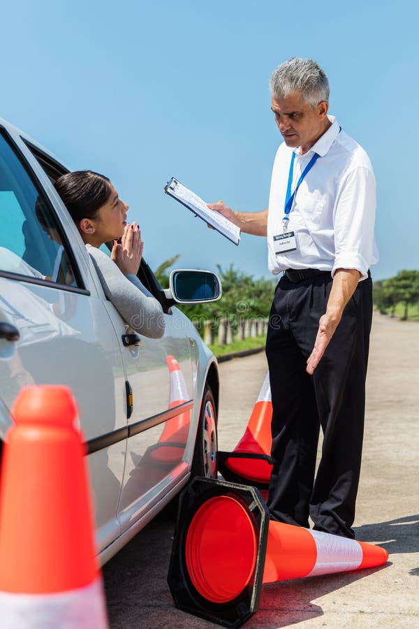 Learner driver apologising royalty free stock photo