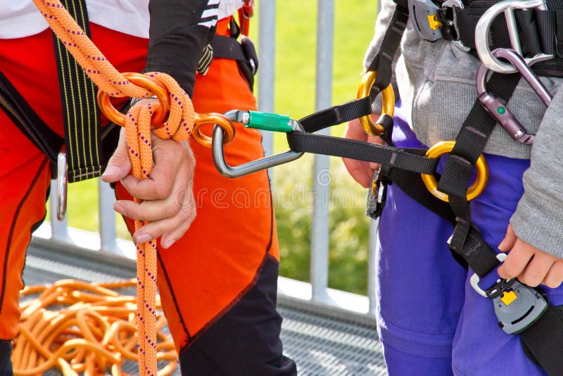 Climbing exersice on a tower. Female climbing high risk building stock images, royalty-free photos and pictures