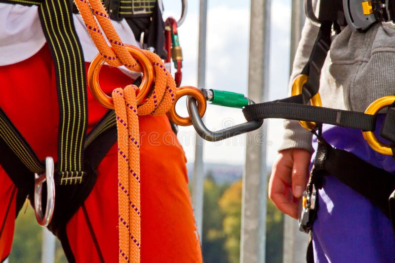 Climbing exersice on a tower. Female climbing high risk building stock images, royalty-free photos and pictures