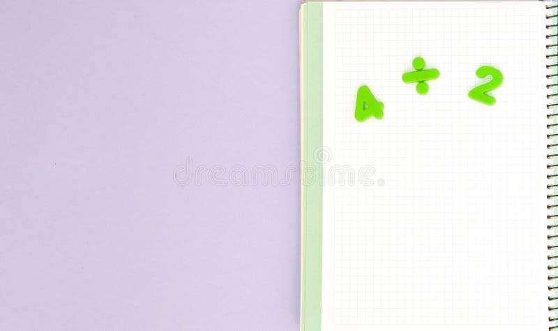 Learning maths. Kid`s desk with blank notebook and numbers top view with copy space stock photography Learning maths. Kid`s desk with blank notebook and numbers top view with copy space stock photography