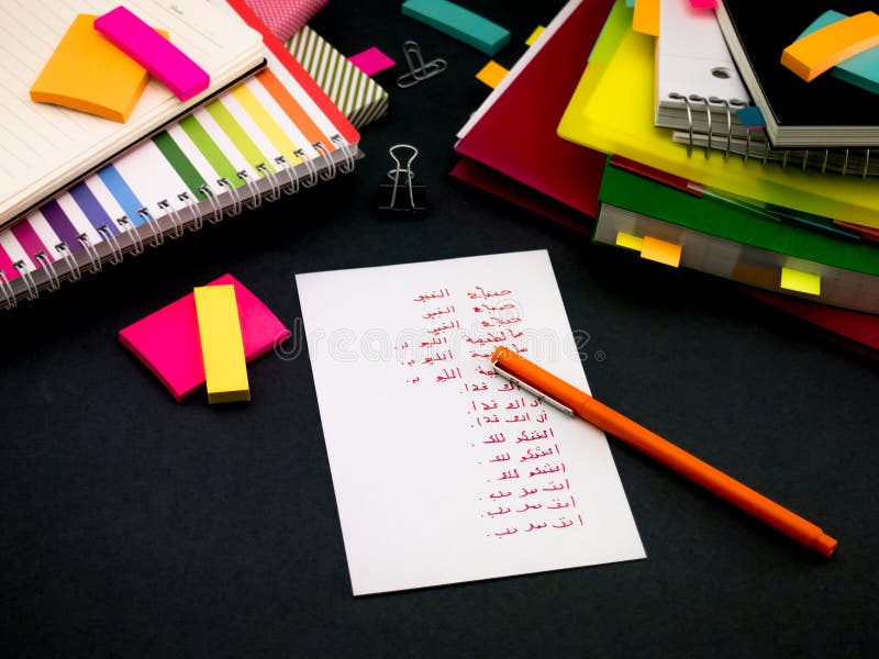 Learning New Language Writing Words Many Times on the Notebook; Arabic. Arabic learning new language stock images, royalty-free photos and pictures