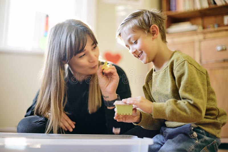 Learning, playing and toys with mother and son for creative, imagination and education. Child development, building royalty free stock image