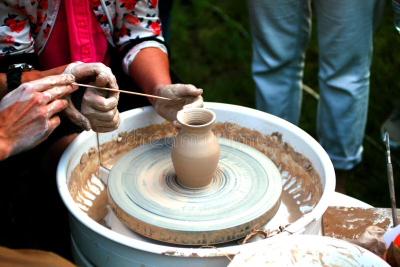 Learning pottery craft. Master class for clay modeling. Earthenware jug making.