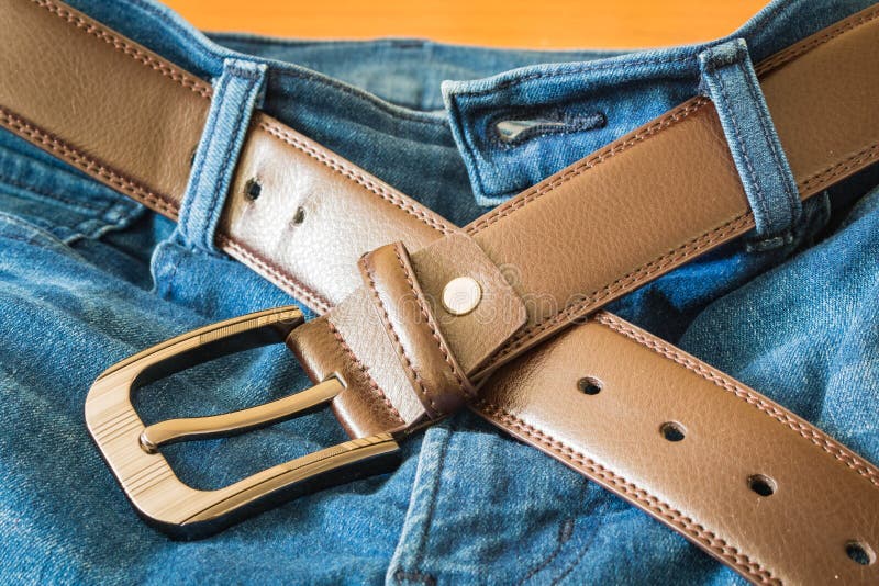 Leather belt on jeans pants