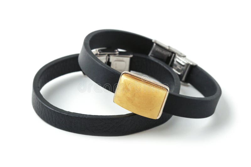 Leather bracelets decorated with amber, isolated on a white background. Leather bracelets decorated with amber, isolated on a white background