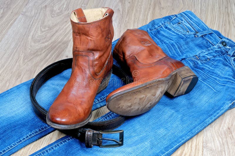 Leather Brown Cowboy Boots and Belt on Blue Jeans Stock Photo - Image ...