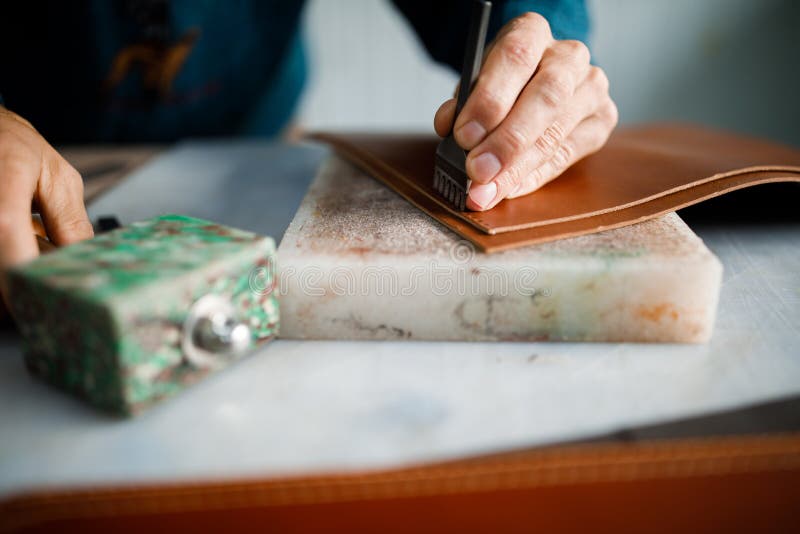 Craftsman Works with Leather, Manufacturing Leather Goods, Cutting with