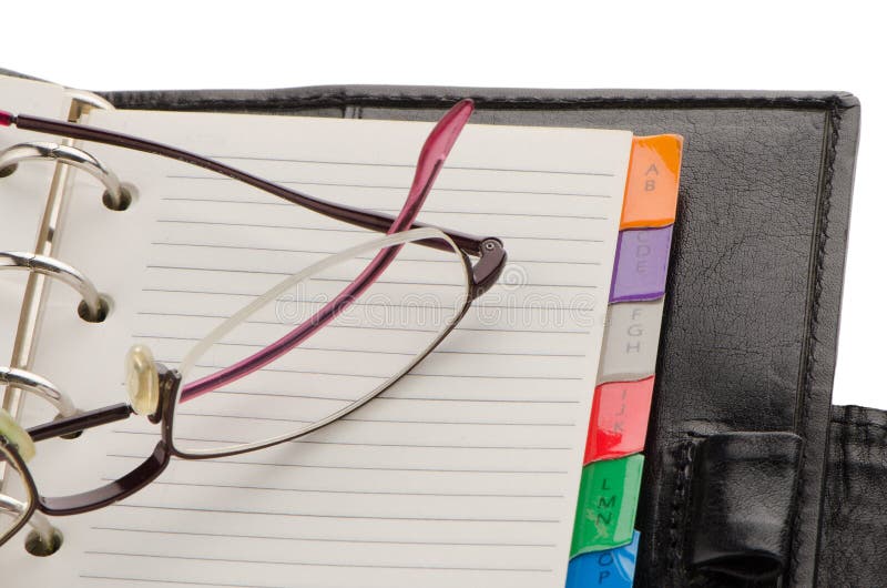 Leather notebook and glasses stock photography