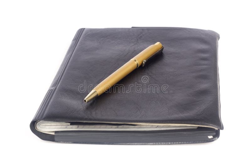 Leather notebook with pen royalty free stock photo