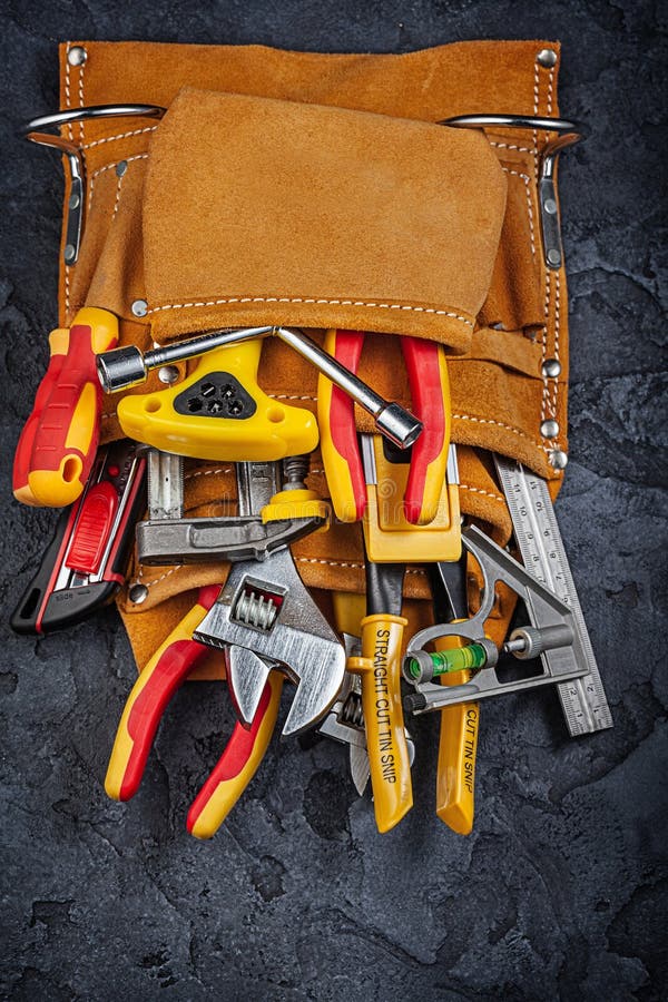 Leather Tool Belt with Construction Tools on Black Background Stock