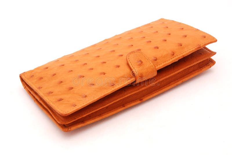 A big brown ostrich leather wallet. Image isolated on white studio background. A big brown ostrich leather wallet. Image isolated on white studio background.