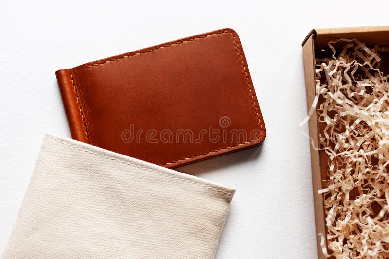 Leather Wallet from a Gift Box on a White Background. Stock Photo