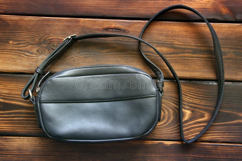 Leather women bag on wooden background royalty free stock photography Leather women bag on wooden background royalty free stock photography