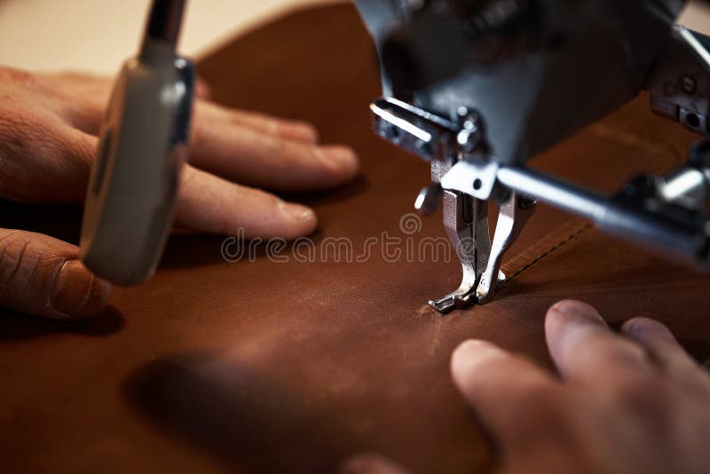 Leatherworker Workflow. a Tanner or Skinner Sews Leather on a Special